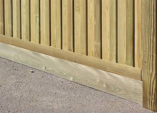 Timber gravel board fitted below featheredge fencing