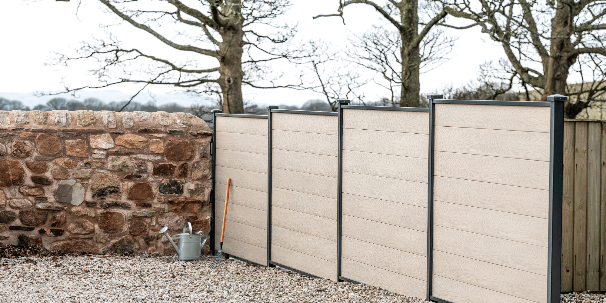 DuraPost VISTA composite fencing in a landscaped garden
